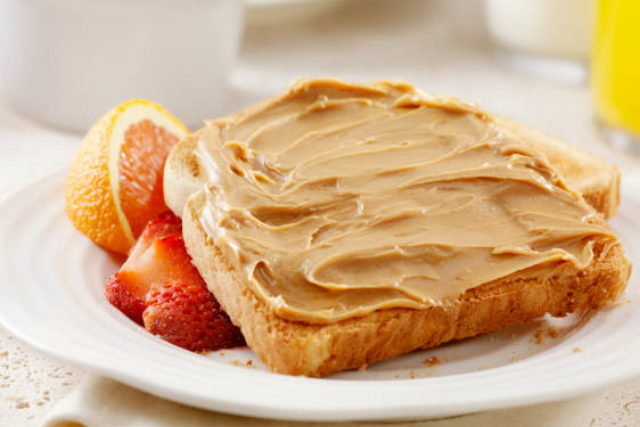 Whole-Wheat Bagel with Peanut Butter and a Side of Orange